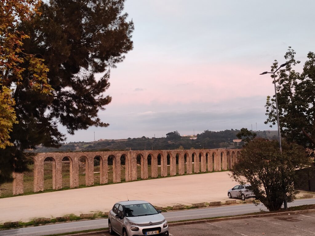 A long arched wall on the outside of the walled city of Obidos in Central Portugal.
